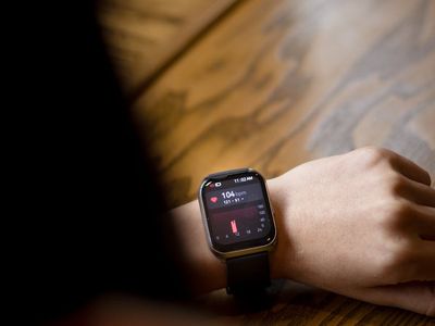 Close-up of heart rate monitor on a person's wrist.